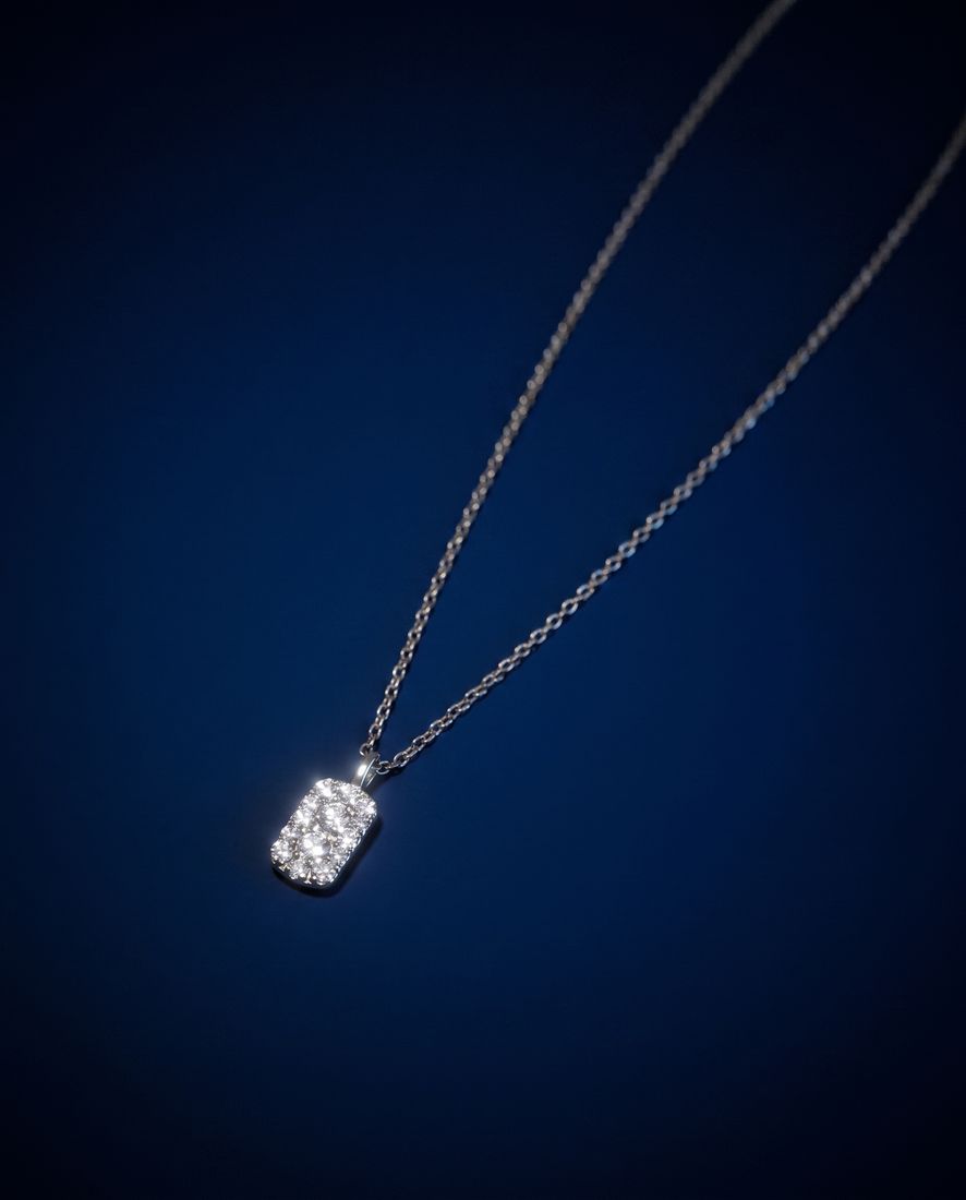 Fine gold chain with a small rectangular pendant set with cognac lab-grown diamonds