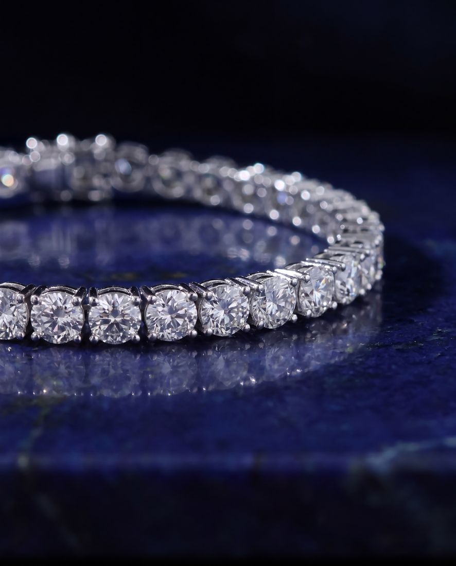 Wide tennis bracelet with a continuous line of large round lab-grown diamonds in gold