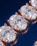 Tennis bracelet of oval-cut lab-grown diamonds set side by side in gold