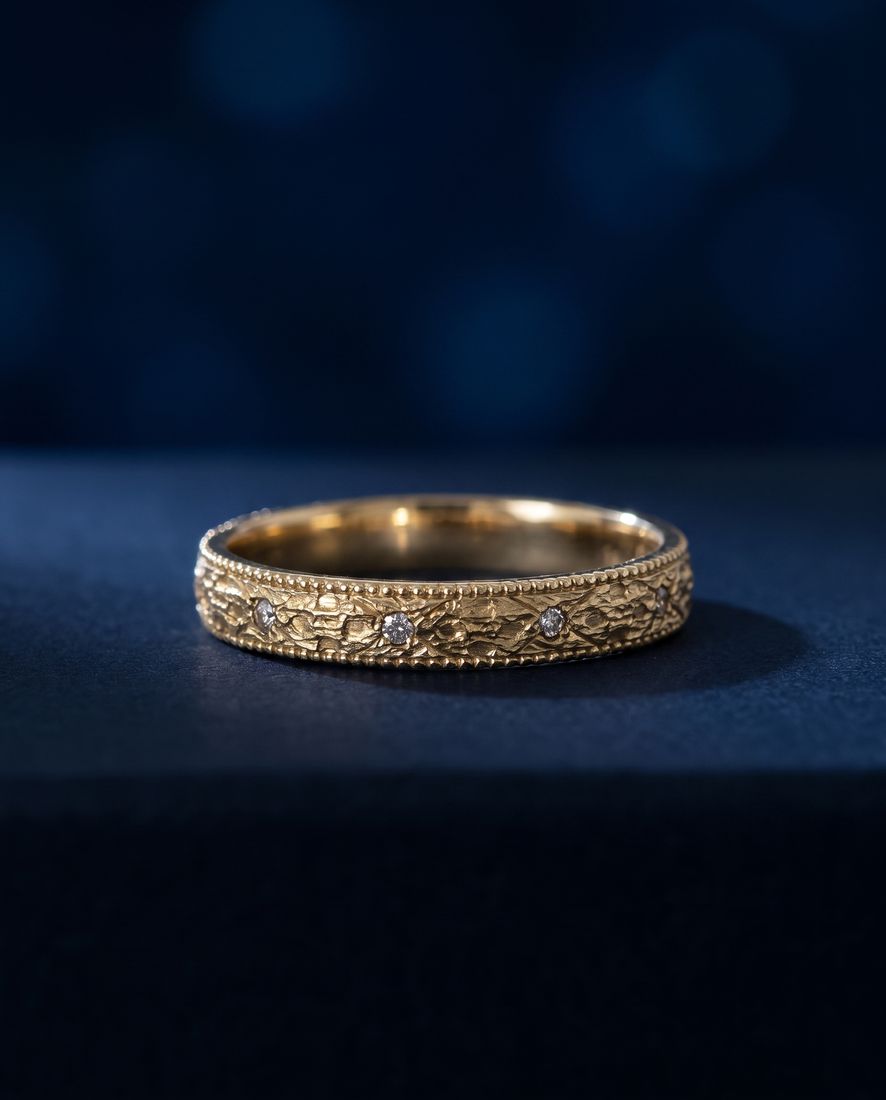 Gold ring with a pleated fluted band set with small cognac lab-grown diamonds