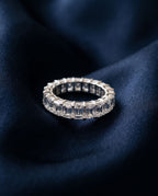 Gold eternity band set all the way around with rectangular emerald-cut lab-grown diamonds