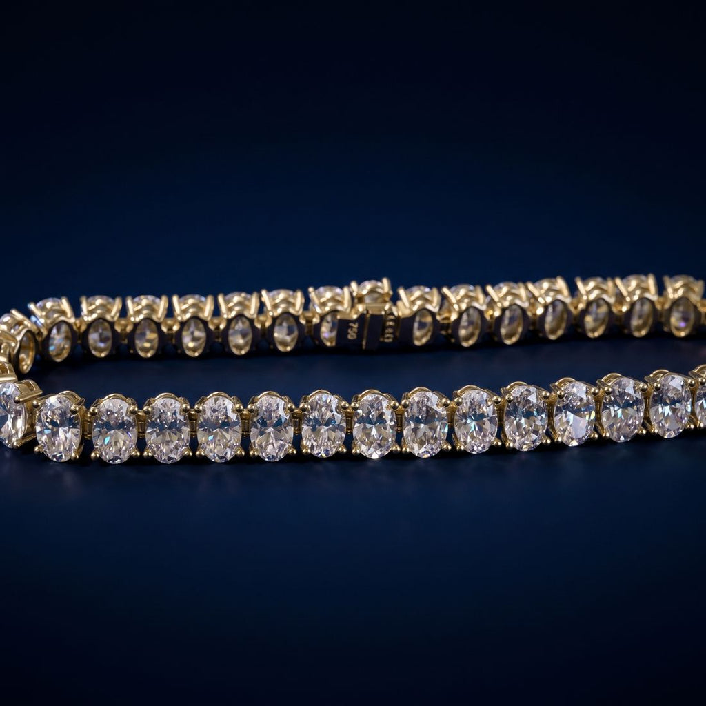 Tennis bracelet of oval-cut lab-grown diamonds set side by side in gold