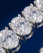 Tennis bracelet of oval-cut lab-grown diamonds set side by side in gold