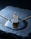Fine gold chain with a small rectangular pendant set with cognac lab-grown diamonds