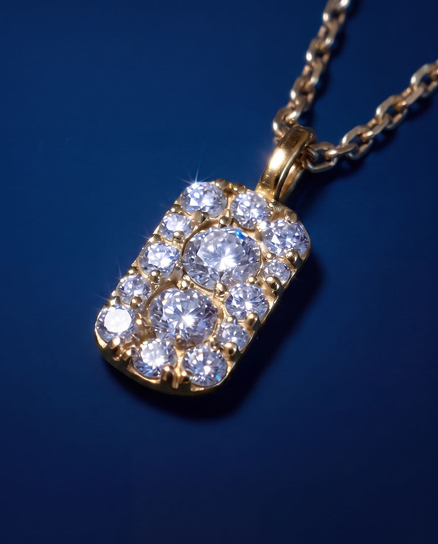 Fine gold chain with a small rectangular pendant set with cognac lab-grown diamonds