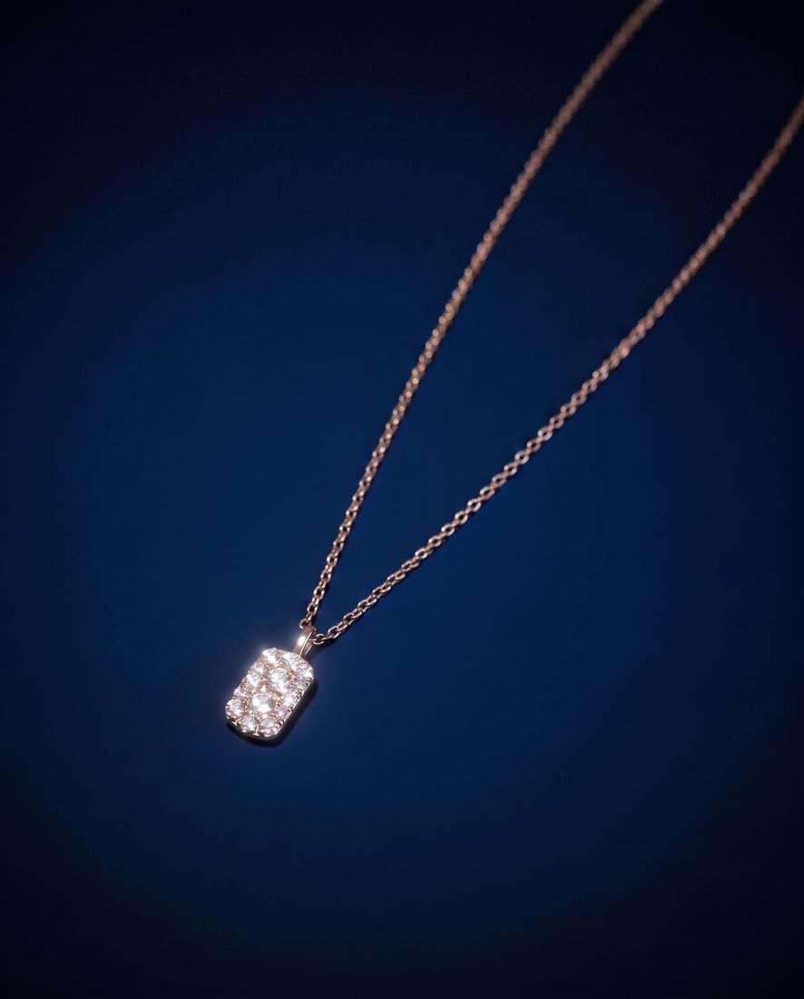 Fine gold chain with a small rectangular pendant set with cognac lab-grown diamonds