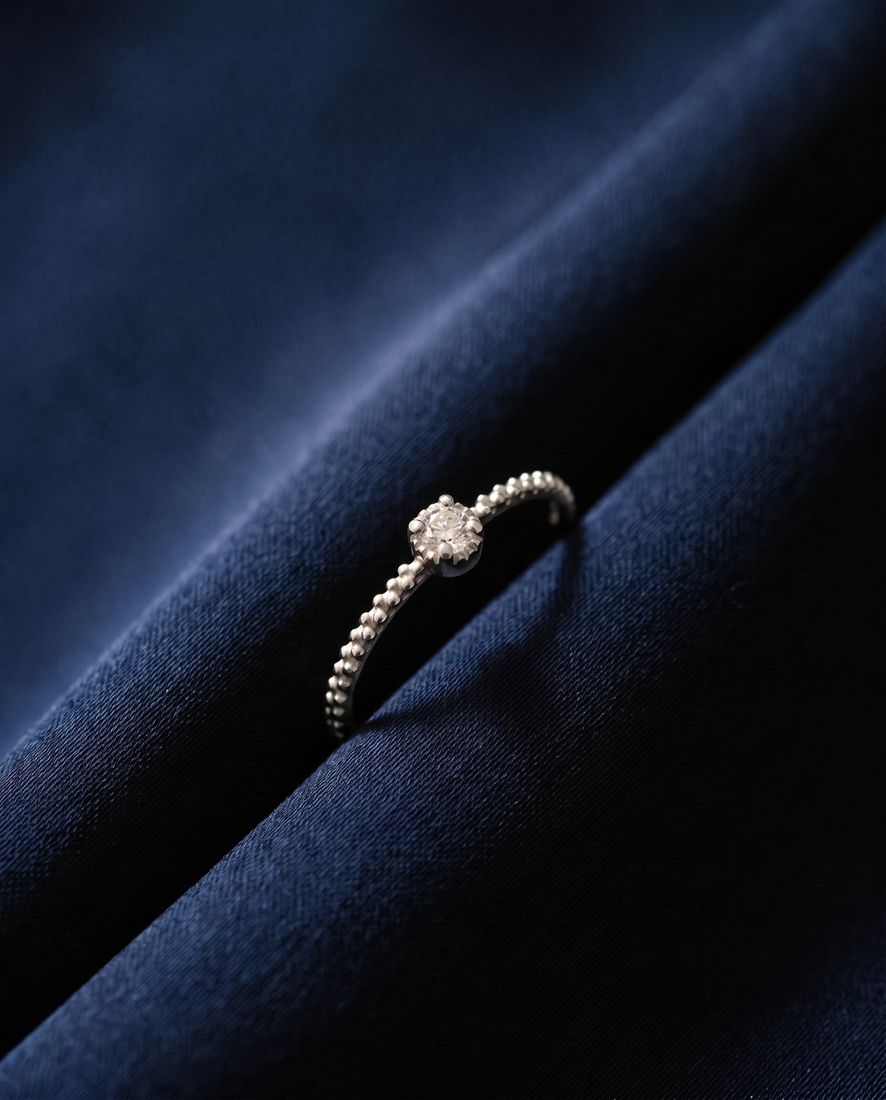Thin twisted gold band set with a single cognac lab-grown diamond
