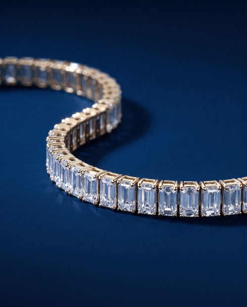 Tennis bracelet of rectangular baguette-cut lab-grown diamonds set end to end in gold