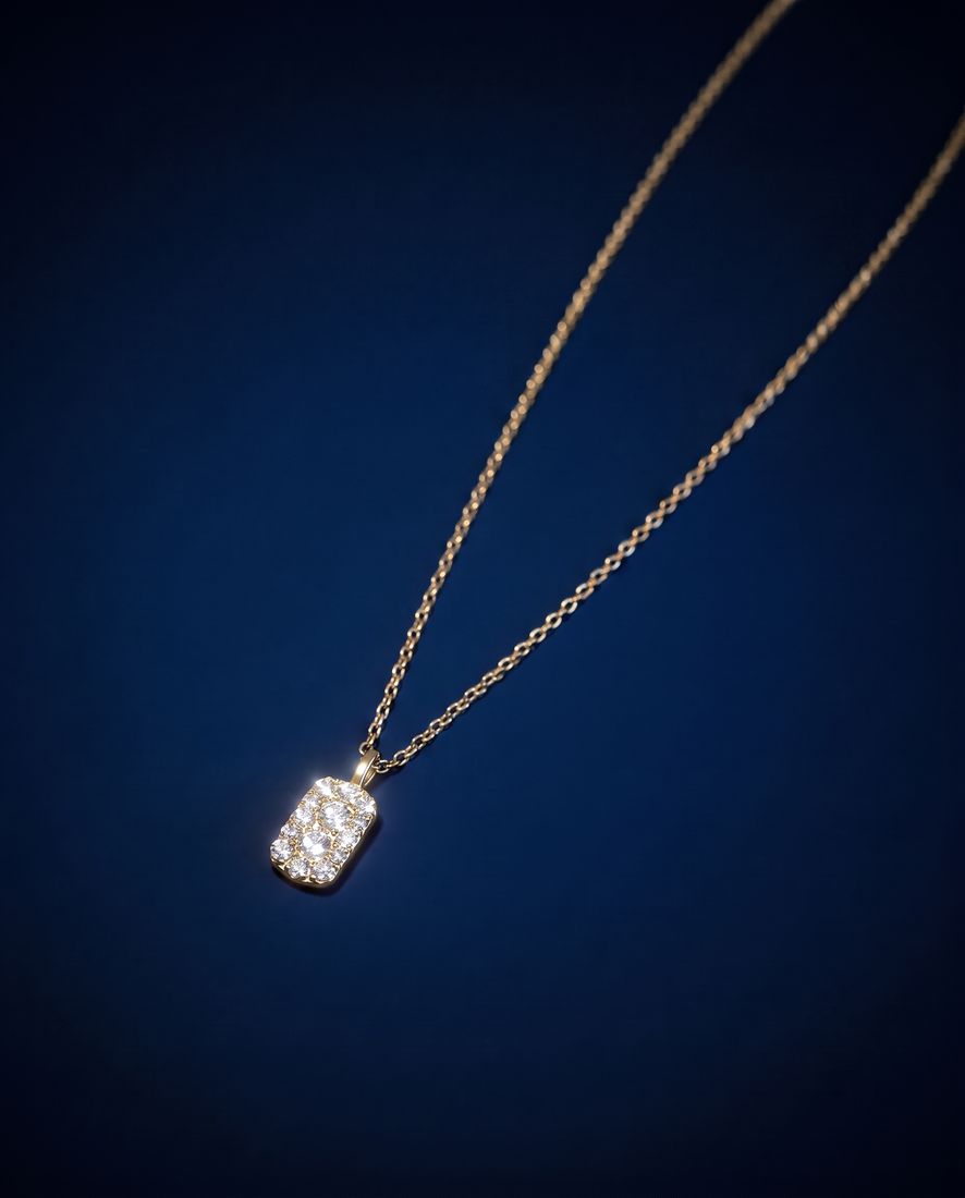 Fine gold chain with a small rectangular pendant set with cognac lab-grown diamonds