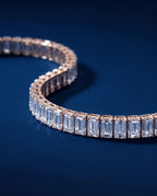 Tennis bracelet of rectangular baguette-cut lab-grown diamonds set end to end in gold