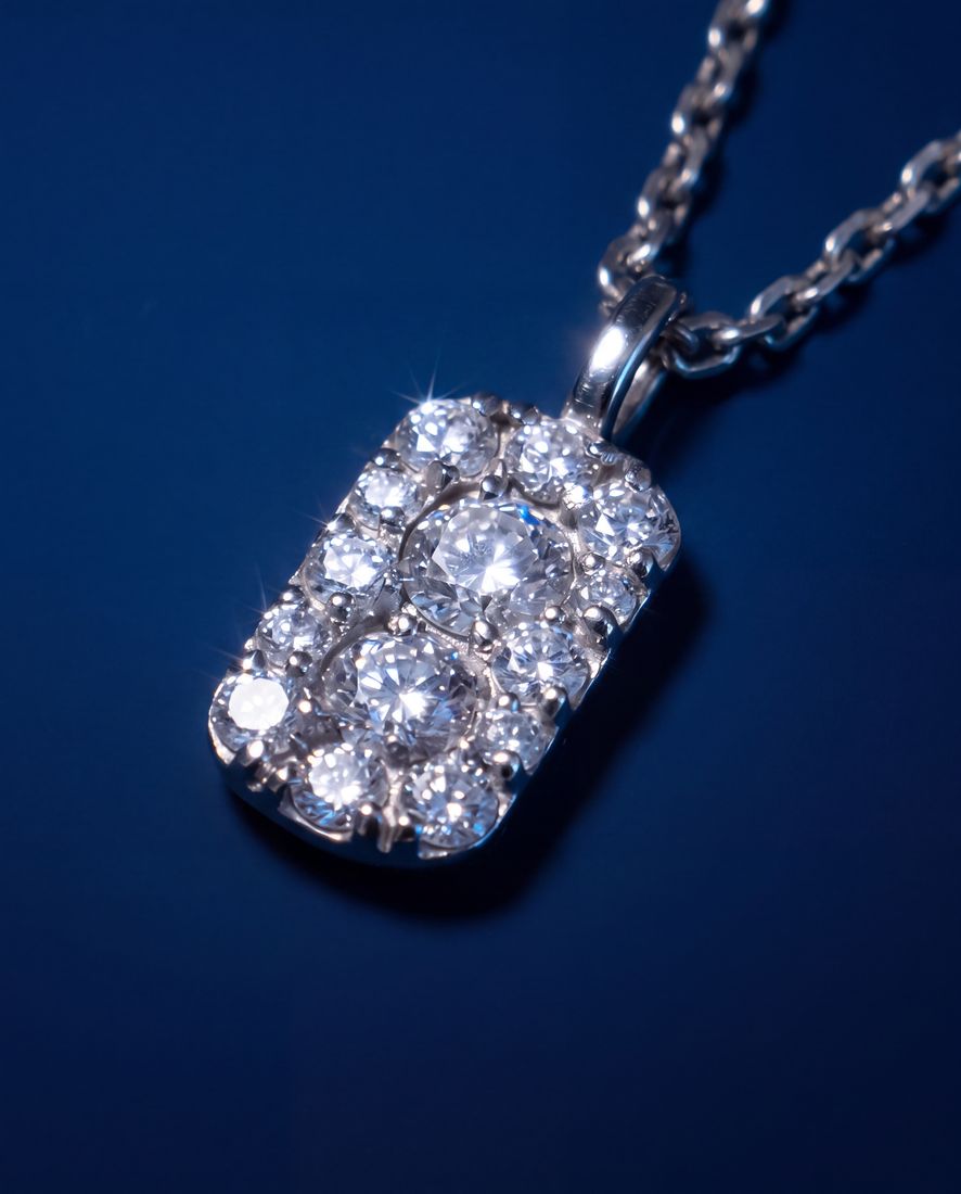 Fine gold chain with a small rectangular pendant set with cognac lab-grown diamonds