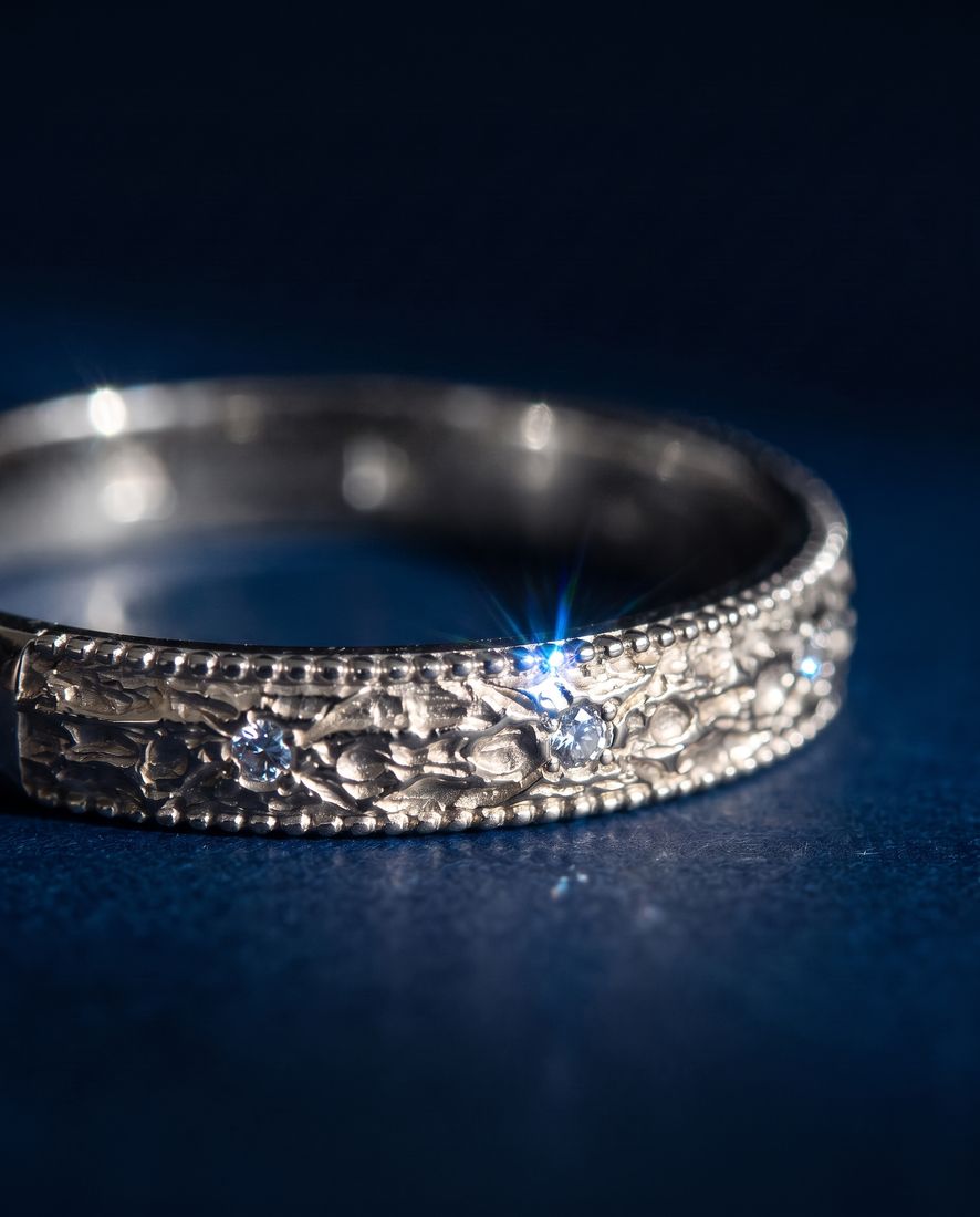 Gold ring with a pleated fluted band set with small cognac lab-grown diamonds