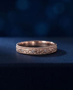Gold ring with a pleated fluted band set with small cognac lab-grown diamonds