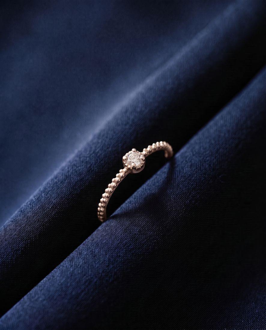 Thin twisted gold band set with a single cognac lab-grown diamond