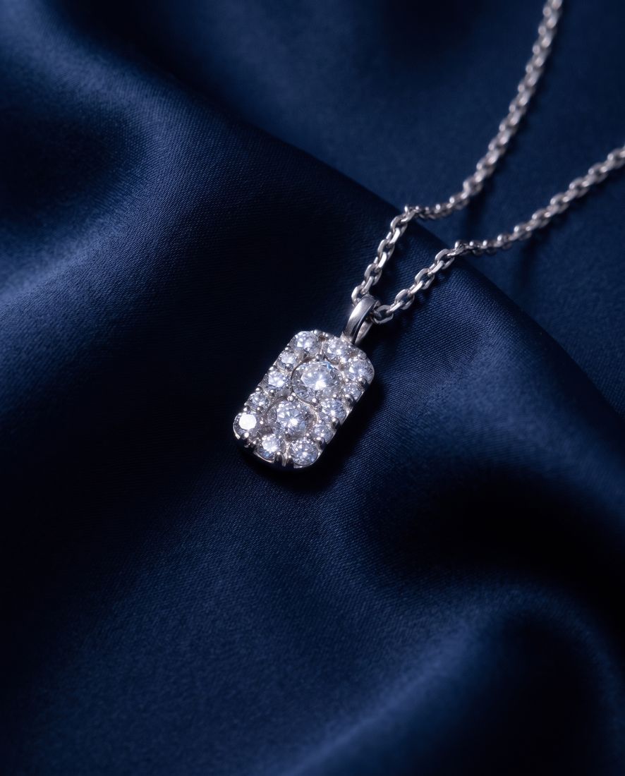 Fine gold chain with a small rectangular pendant set with cognac lab-grown diamonds