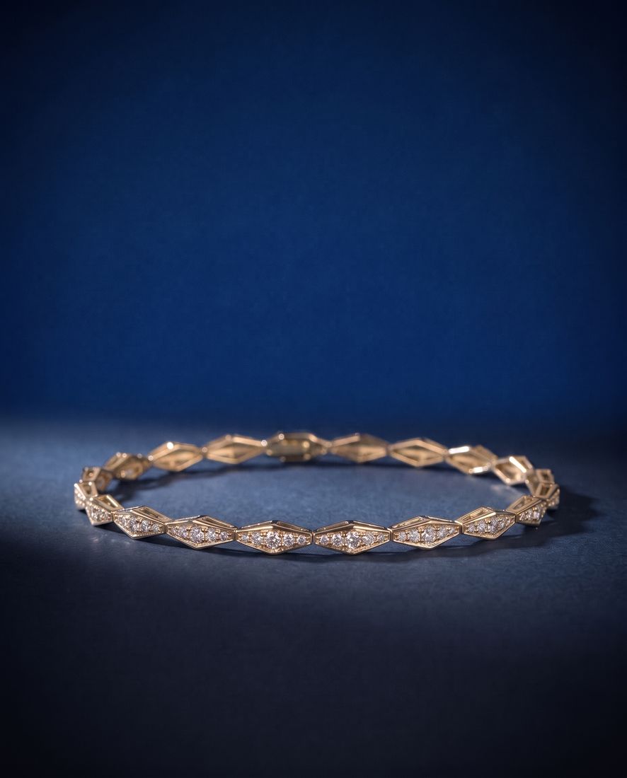 Solid gold bracelet of faceted rhombus links pavé-set with small round lab-grown diamonds, shown on a plain ground
