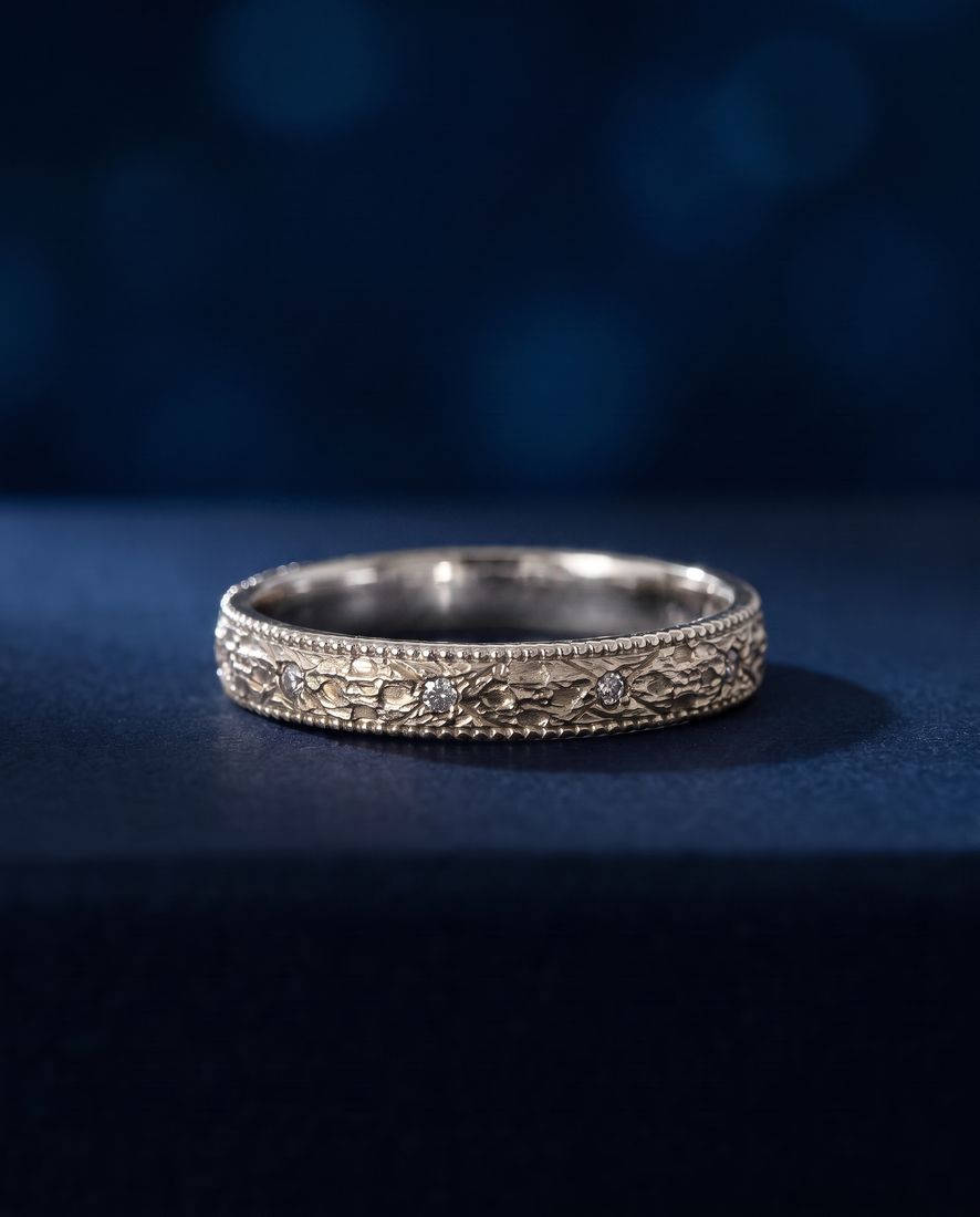 Gold ring with a pleated fluted band set with small cognac lab-grown diamonds