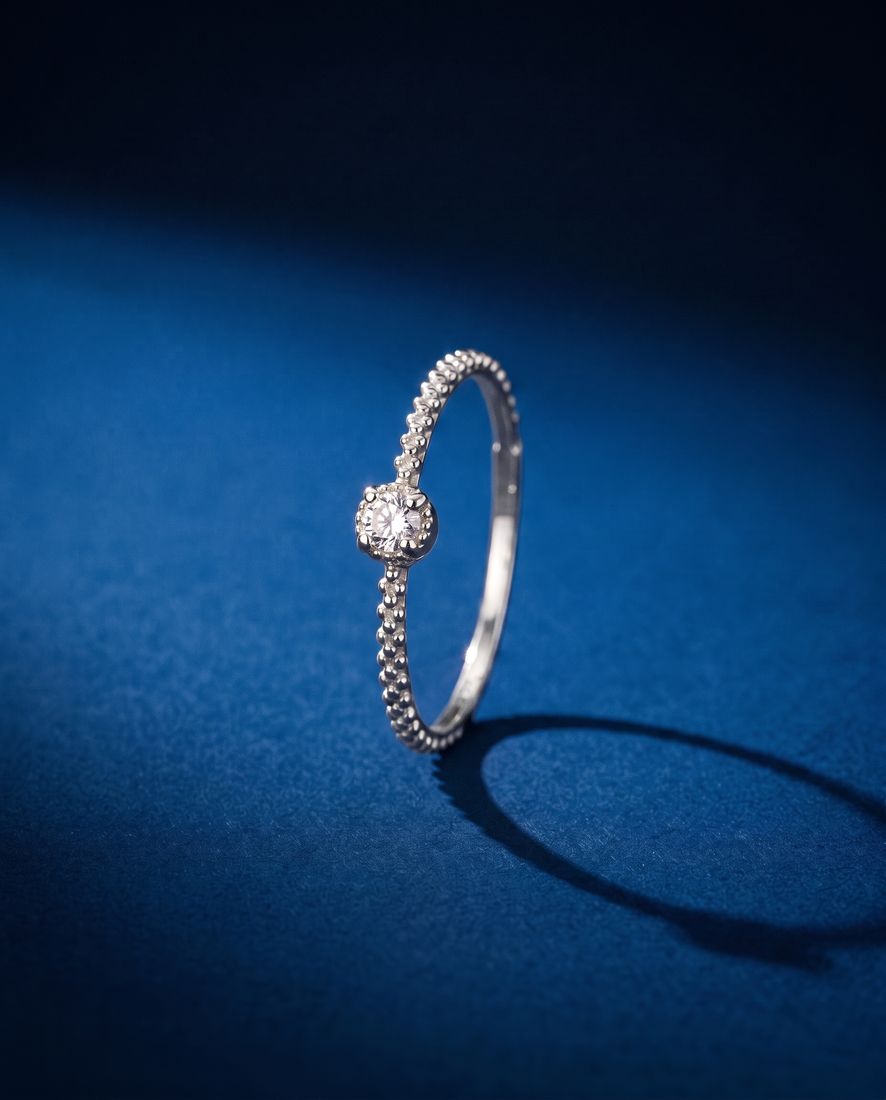 Thin twisted gold band set with a single cognac lab-grown diamond