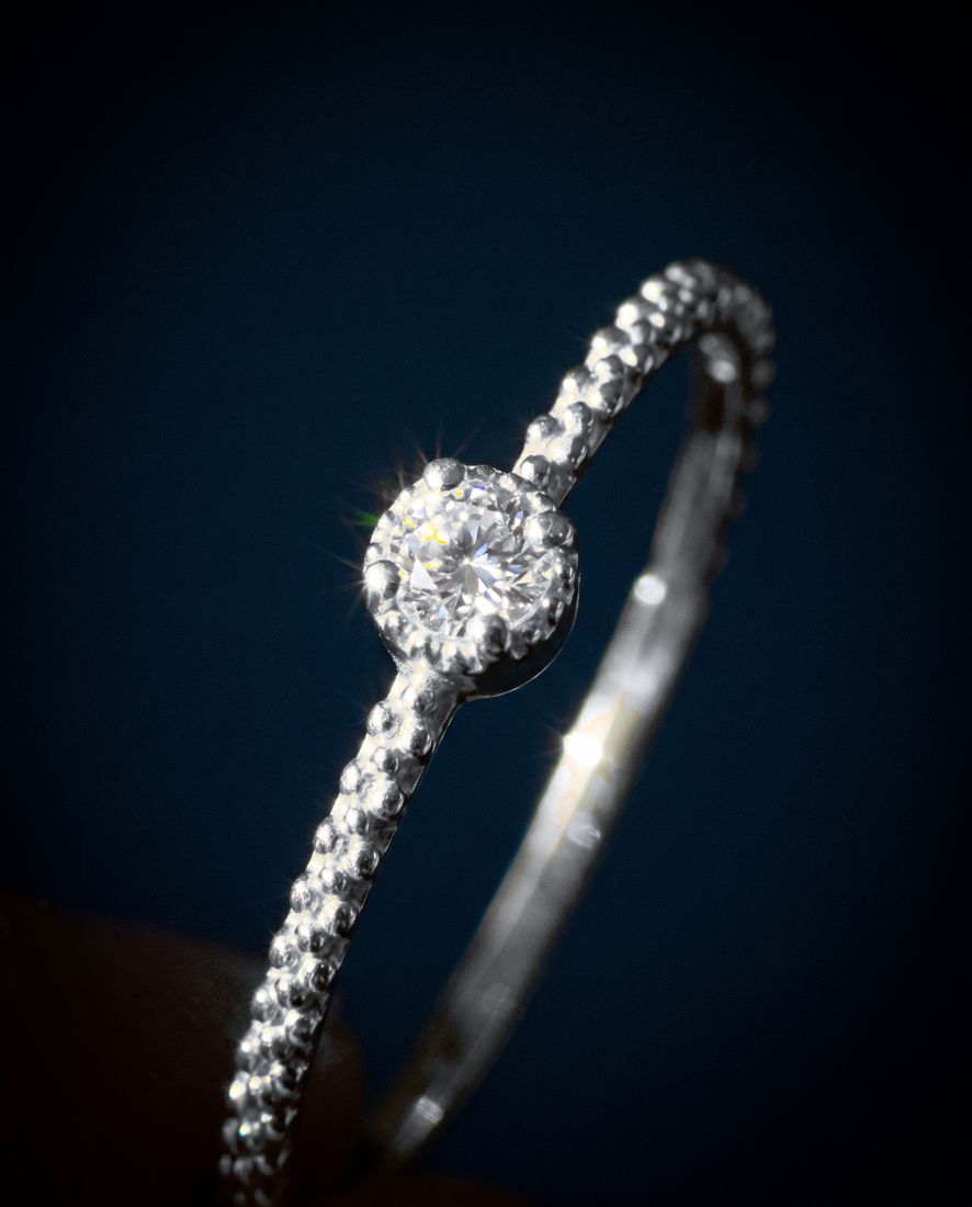 Thin twisted gold band set with a single cognac lab-grown diamond