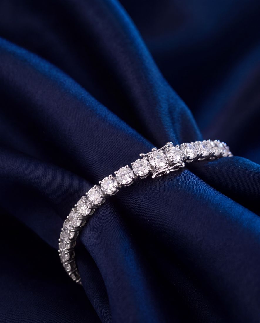 Wide tennis bracelet with a continuous line of large round lab-grown diamonds in gold