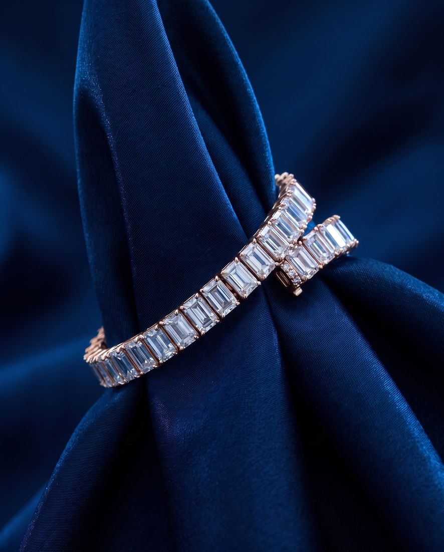 Tennis bracelet of rectangular baguette-cut lab-grown diamonds set end to end in gold