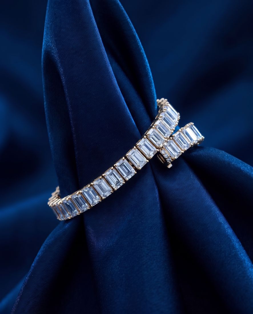 Tennis bracelet of rectangular baguette-cut lab-grown diamonds set end to end in gold