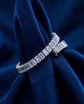 Tennis bracelet of rectangular baguette-cut lab-grown diamonds set end to end in gold