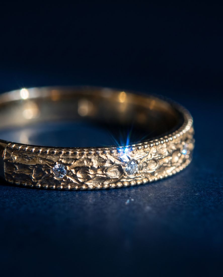 Gold ring with a pleated fluted band set with small cognac lab-grown diamonds