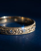 Gold ring with a pleated fluted band set with small cognac lab-grown diamonds