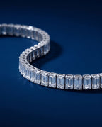 Tennis bracelet of rectangular baguette-cut lab-grown diamonds set end to end in gold