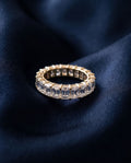 Gold eternity band set all the way around with rectangular emerald-cut lab-grown diamonds
